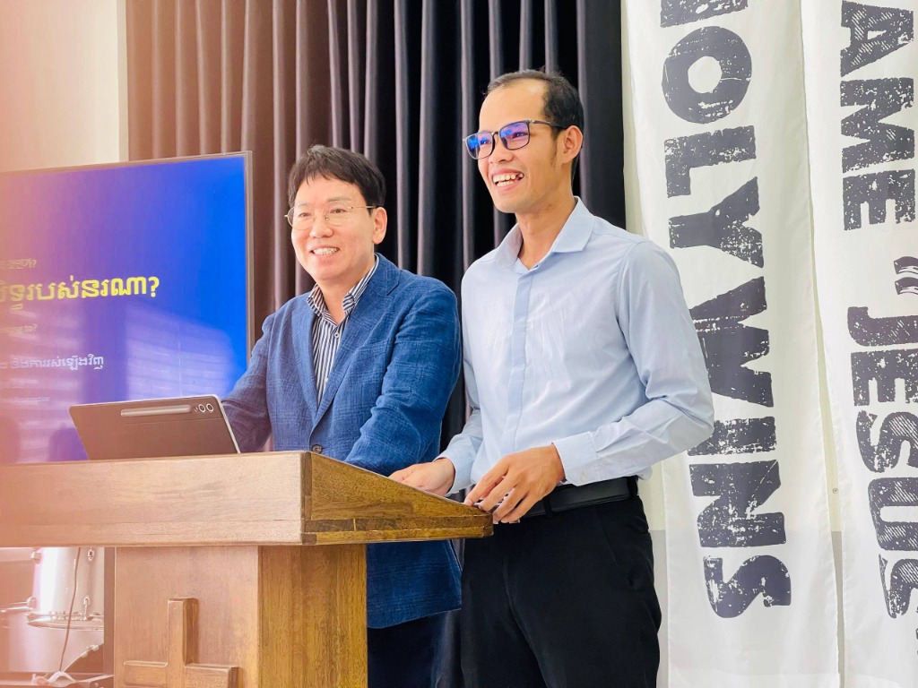 Leader Hun Chet and Pastor Kim Jong Ho preaching from the pulpit
